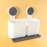 Side angle view of wall mounted toothbrush holder with three compartments
