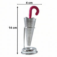 Loose leaf tea brewing inside a glass cup with the elegant stainless steel umbrella tea infuser.