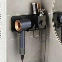 Dryer rack mounted on bathroom wall holding hair styling tools