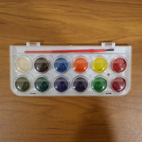 12 vibrant watercolor cakes in a compact kit