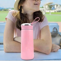 Hydrozilla pink glass water bottle in lifestyle gym setting