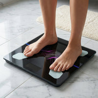 A person standing on the digital weighing scale, demonstrating its stable platform.