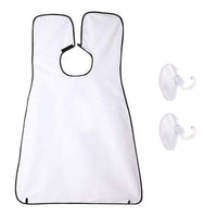 Man using a black beard apron with suction cups to catch hair clippings while shaving.