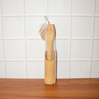 Natural bamboo cooking spatula set styled on kitchen counter