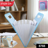 Expanding plastic file folder showing flexible storage capacity and handle