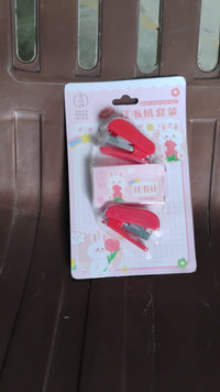 The FiloDesk mini stapler set displayed with its included staples.