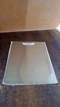 Durable stainless steel cutting board with handle, perfect for home kitchens