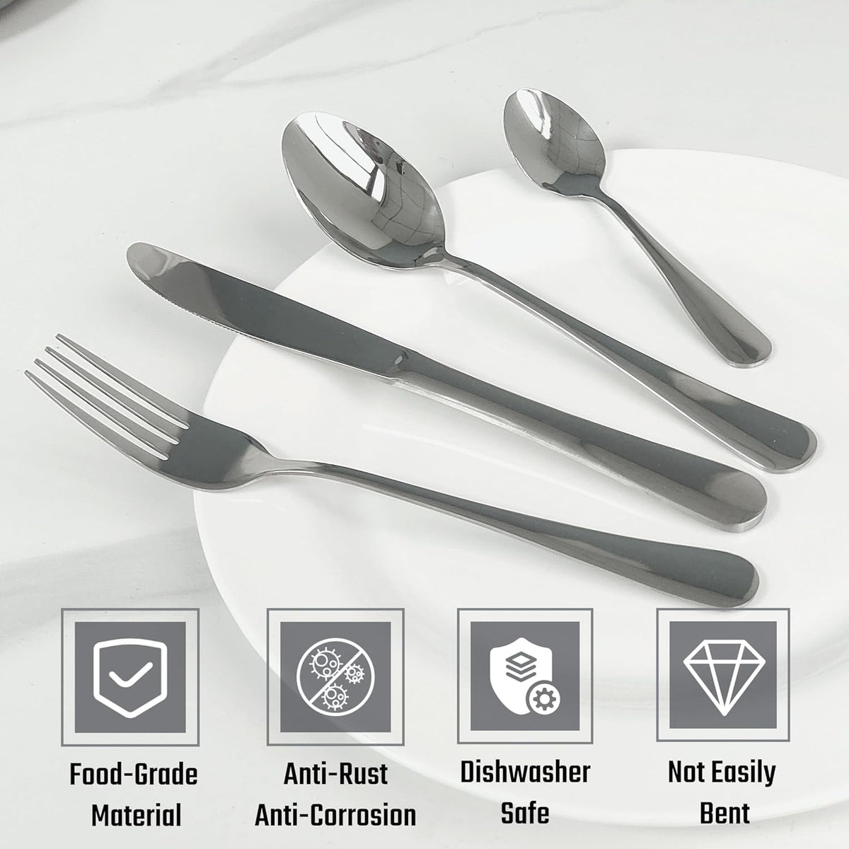 Elegant dining table arrangement with polished stainless steel cutlery