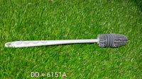 A bottle cleaning brush shown cleaning a narrow-necked bottle with ease.