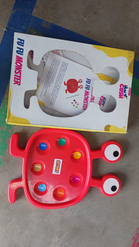 Close-up of the Fu Fu Monster plastic toy, highlighting its safe and durable features.