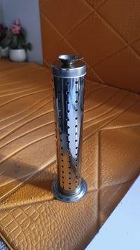 Close-up of stainless steel incense stand with child-safe design