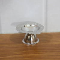 Spiritual puja decoration with stainless steel diya stand