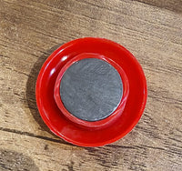 Arrangement of red magnetic buttons on a magnetic office board