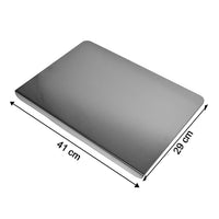 Stainless steel chopping board placed on kitchen counter for vegetable cutting