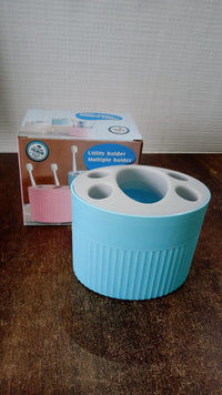 Bathroom countertop toothbrush and utility holder with waterproof design