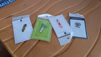 Single stylish metal enamel badge pin with random design