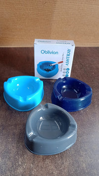 Angled view of plastic ashtray on wooden table
