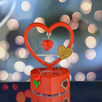 LED light showpiece shaped like a heart with rose accent and hanging love pendants