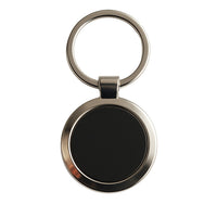 Classic round key ring featuring a chrome border with black center insert.