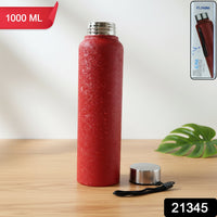 Angled side view of red insulated stainless steel water bottle