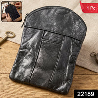 Close-up of the black leather mini pouch showing the zipper and front slip pocket.