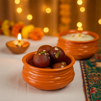 Closeup of glossy finish on terracotta-style serving bowl