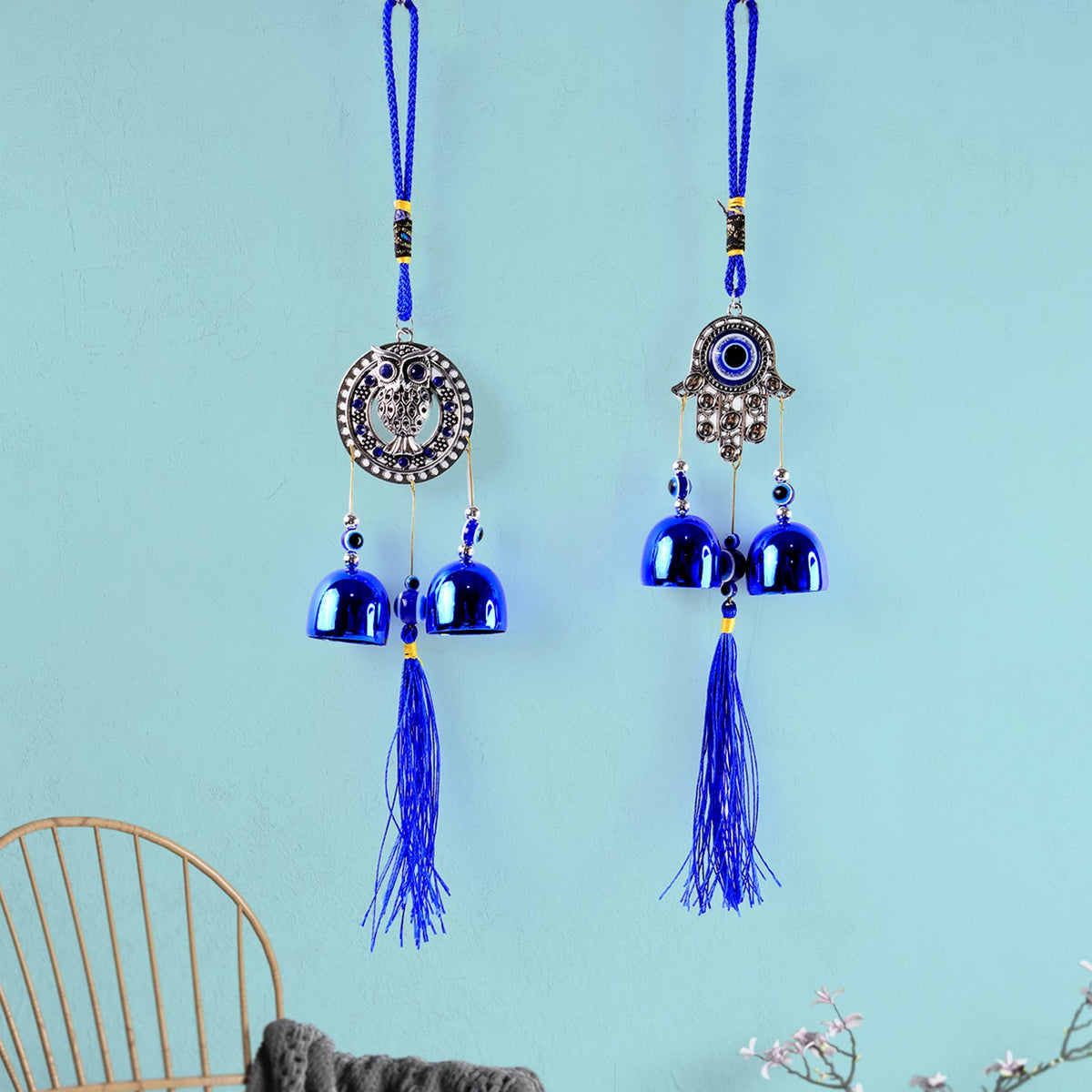 Multiple metal bells on evil eye wind chime creating soothing sounds